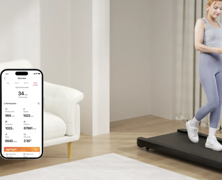 A woman on a walking pad in her living room.